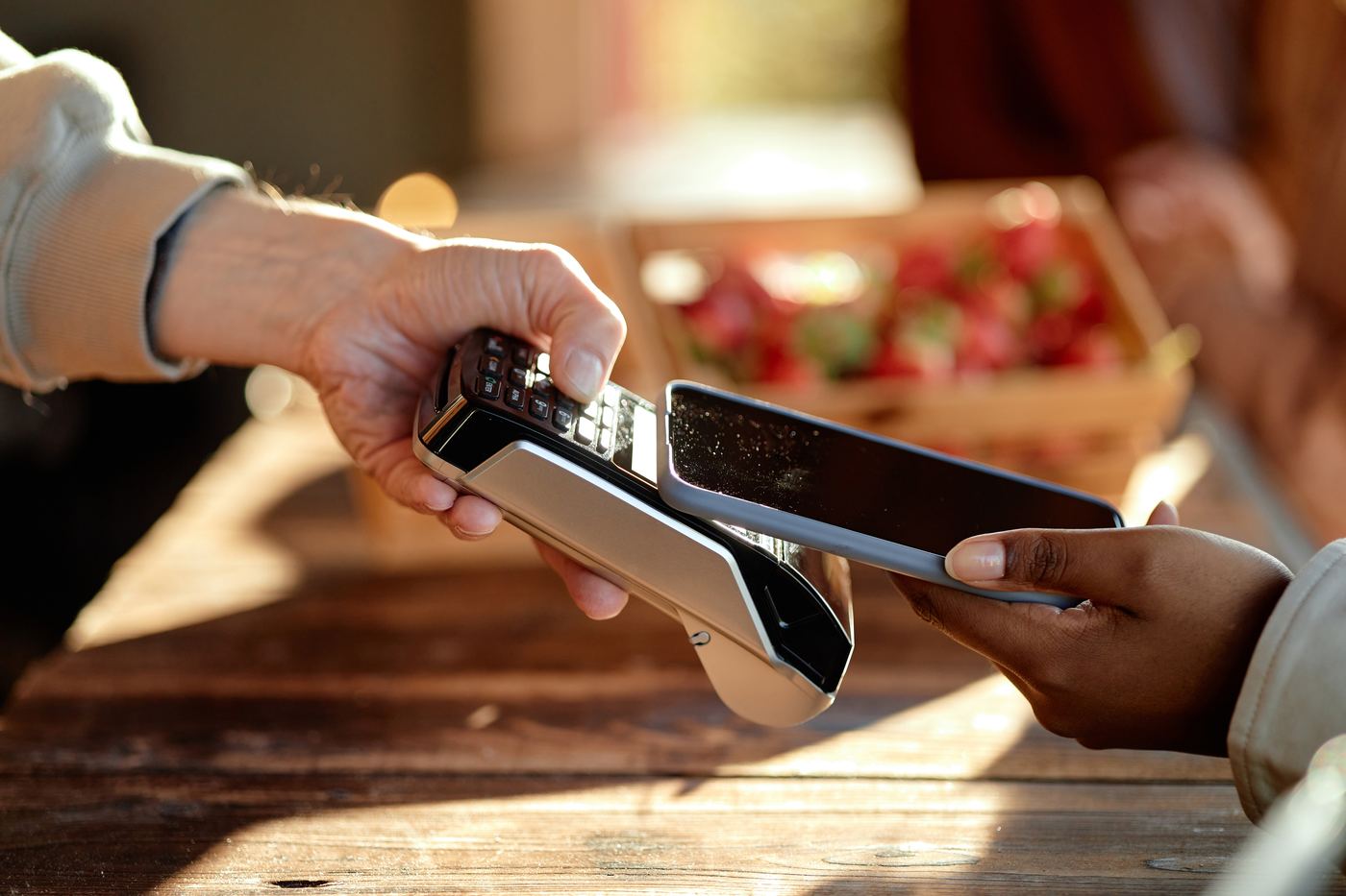 Customer paying with a phone at a card terminal